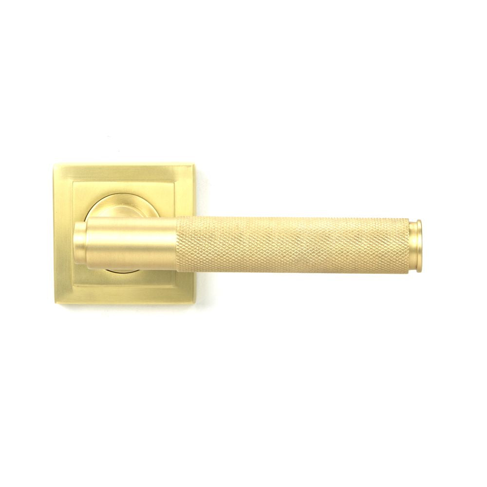 This is an image showing From The Anvil - Satin Brass Brompton Lever on Rose Set (Square) - Unsprung available from trade door handles, quick delivery and discounted prices