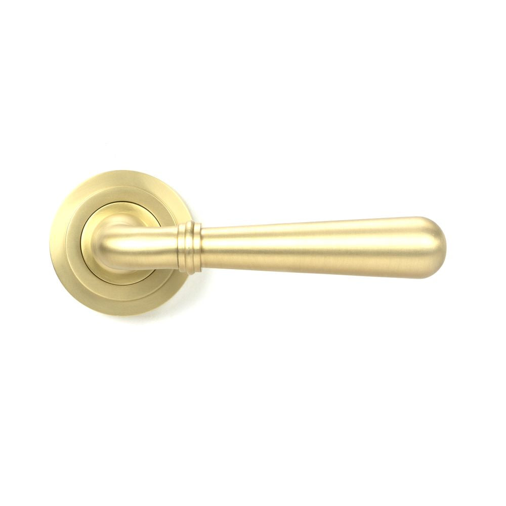 This is an image showing From The Anvil - Satin Brass Newbury Lever on Rose Set (Art Deco) - Unsprung available from trade door handles, quick delivery and discounted prices