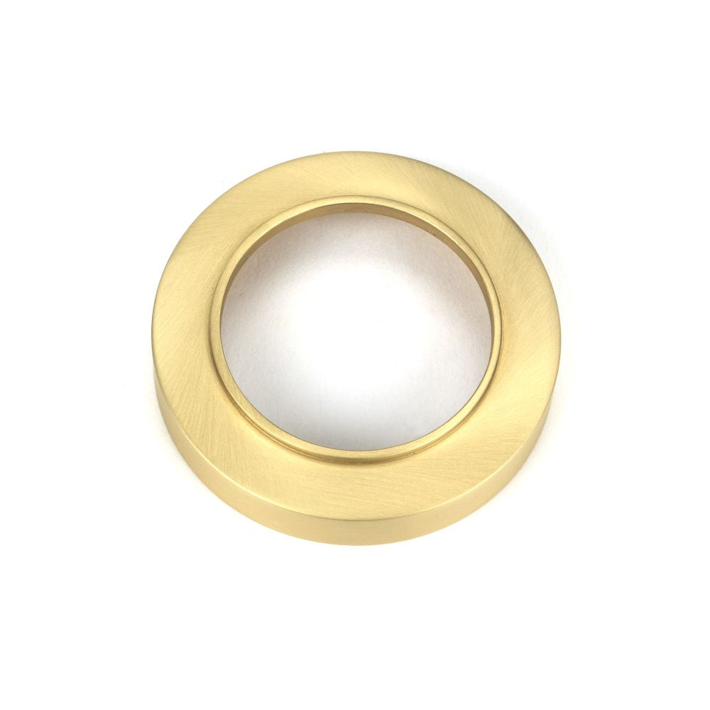 This is an image showing From The Anvil - Satin Brass Round Euro Escutcheon (Plain) available from trade door handles, quick delivery and discounted prices