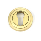 This is an image of From The Anvil - Satin Brass Round Euro Escutcheon (Art Deco) available to order from T.H Wiggans Architectural Ironmongery in Kendal, quick delivery and discounted prices.