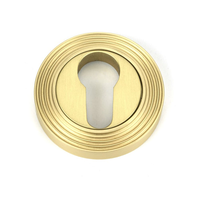 This is an image of From The Anvil - Satin Brass Round Euro Escutcheon (Beehive) available to order from T.H Wiggans Architectural Ironmongery in Kendal, quick delivery and discounted prices.