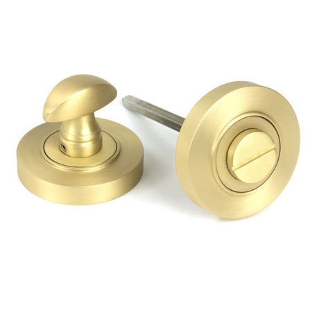 This is an image of From The Anvil - Satin Brass Round Thumbturn Set (Plain) available to order from T.H Wiggans Architectural Ironmongery in Kendal, quick delivery and discounted prices.