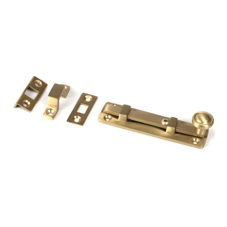 This is an image showing From The Anvil - Satin Brass 4" Universal Bolt available from T.H Wiggans Architectural Ironmongery in Kendal, quick delivery and discounted prices