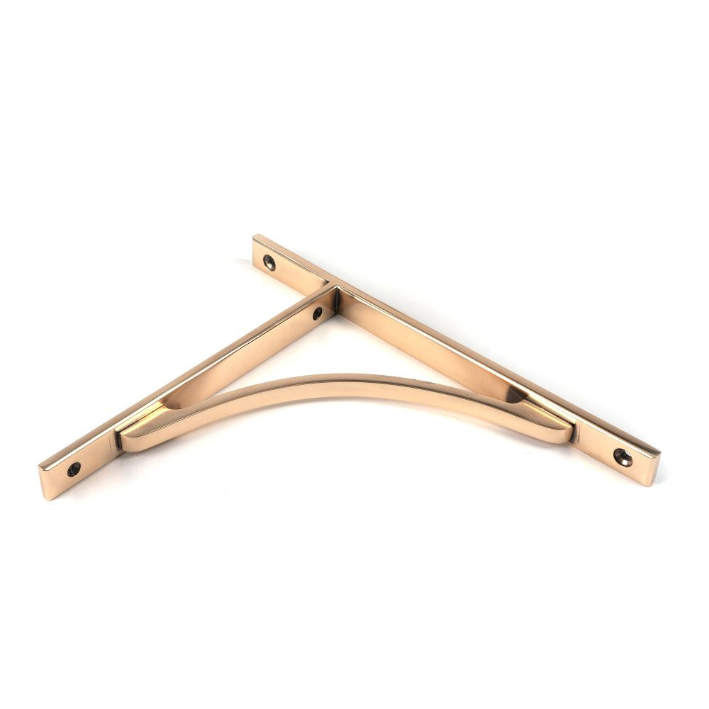 This is an image showing From The Anvil - Polished Bronze Apperley Shelf Bracket (260mm x 200mm) available from trade door handles, quick delivery and discounted prices