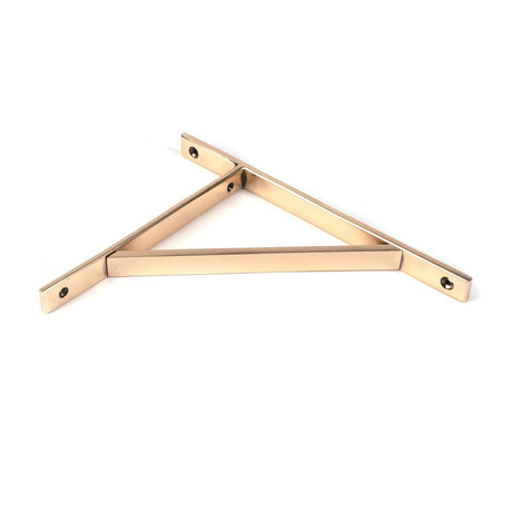 This is an image showing From The Anvil - Polished Bronze Chalfont Shelf Bracket (260mm x 200mm) available from trade door handles, quick delivery and discounted prices