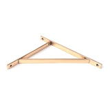 This is an image showing From The Anvil - Polished Bronze Chalfont Shelf Bracket (314mm x 250mm) available from trade door handles, quick delivery and discounted prices