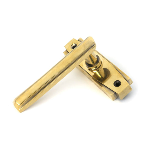 This is an image of From The Anvil - Aged Brass Art Deco Lever on Rose Set available to order from T.H Wiggans Architectural Ironmongery in Kendal, quick delivery and discounted prices.