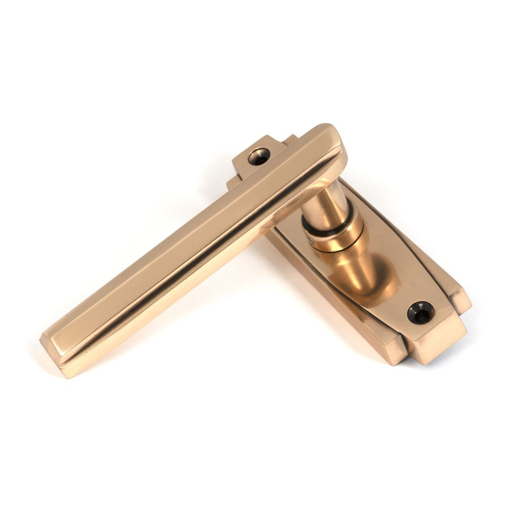 This is an image of From The Anvil - Polished Bronze Art Deco Lever on Rose Set available to order from T.H Wiggans Architectural Ironmongery in Kendal, quick delivery and discounted prices.