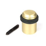 This is an image showing From The Anvil - Satin Brass Floor Mounted Door Stop available from trade door handles, quick delivery and discounted prices