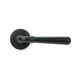 This is an image showing From The Anvil - Matt Black Newbury Lever on Rose Set (Art Deco) - Unsprung available from trade door handles, quick delivery and discounted prices