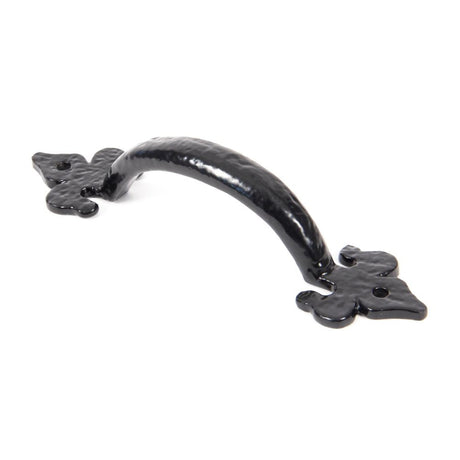 This is an image showing From The Anvil - Black Cast 6" Fleur De Lys Pull Handle available from T.H Wiggans Architectural Ironmongery in Kendal, quick delivery and discounted prices
