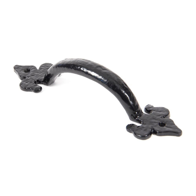 This is an image showing From The Anvil - Black Cast 6" Fleur De Lys Pull Handle available from T.H Wiggans Architectural Ironmongery in Kendal, quick delivery and discounted prices