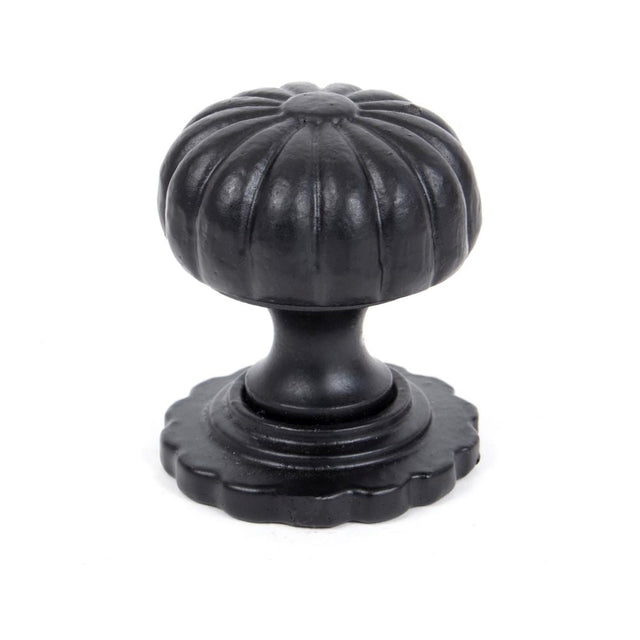 This is an image showing From The Anvil - Black Flower Cabinet Knob - Small available from T.H Wiggans Architectural Ironmongery in Kendal, quick delivery and discounted prices