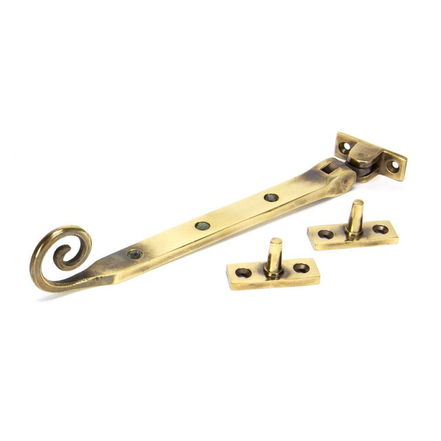 This is an image showing From The Anvil - Aged Brass 8" Monkeytail Stay available from T.H Wiggans Architectural Ironmongery in Kendal, quick delivery and discounted prices