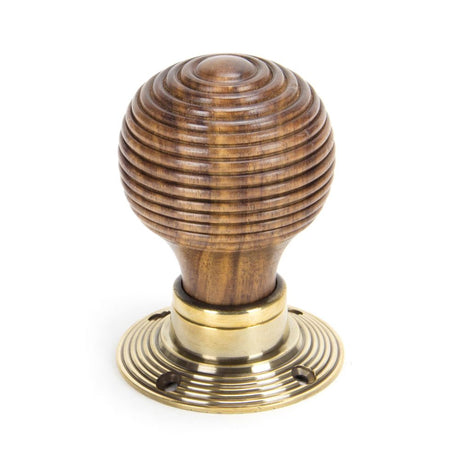 This is an image showing From The Anvil - Rosewood & Aged Brass Beehive Mortice/Rim Knob Set available from trade door handles, quick delivery and discounted prices