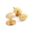 This is an image of From The Anvil - Polished Brass Oval Mortice/Rim Knob Set available to order from T.H Wiggans Architectural Ironmongery in Kendal, quick delivery and discounted prices.