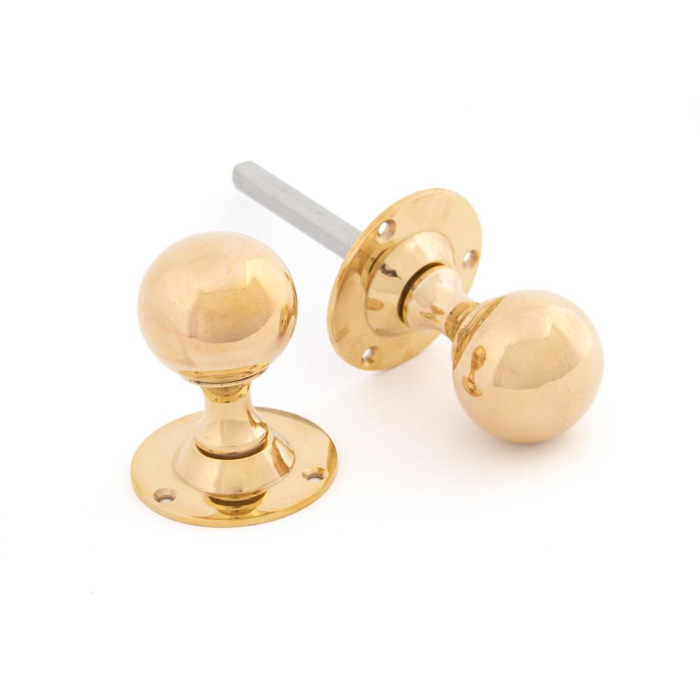 This is an image of From The Anvil - Polished Brass Ball Mortice Knob Set available to order from T.H Wiggans Architectural Ironmongery in Kendal, quick delivery and discounted prices.