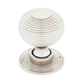 This is an image showing From The Anvil - Polished Nickel Heavy Beehive Mortice/Rim Knob Set available from trade door handles, quick delivery and discounted prices