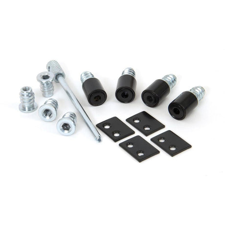 This is an image showing From The Anvil - Black Secure Stops (Pack of 4) available from T.H Wiggans Architectural Ironmongery in Kendal, quick delivery and discounted prices