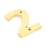 This is an image of From The Anvil - Polished Brass Numeral 2 available to order from T.H Wiggans Architectural Ironmongery in Kendal, quick delivery and discounted prices.