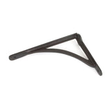 This is an image showing From The Anvil - Beeswax 10'' x 7'' Curved Shelf Bracket available from trade door handles, quick delivery and discounted prices