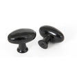 This is an image showing From The Anvil - Black Oval Cabinet Knob available from T.H Wiggans Architectural Ironmongery in Kendal, quick delivery and discounted prices