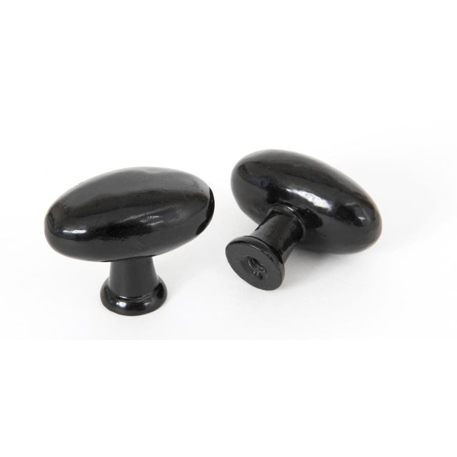 This is an image showing From The Anvil - Black Oval Cabinet Knob available from T.H Wiggans Architectural Ironmongery in Kendal, quick delivery and discounted prices