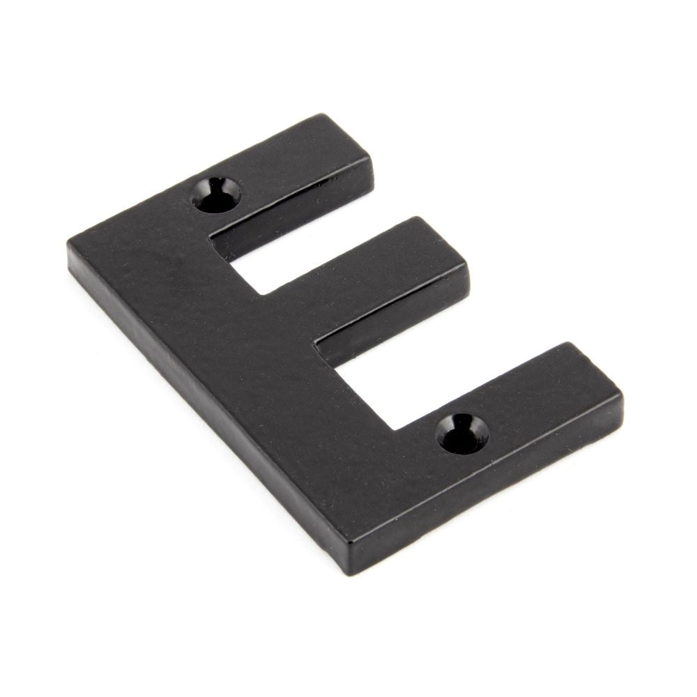 This is an image of From The Anvil - Black Letter E available to order from T.H Wiggans Architectural Ironmongery in Kendal, quick delivery and discounted prices.