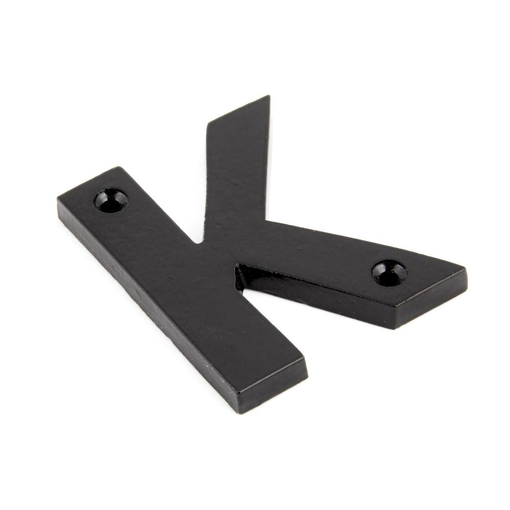 This is an image of From The Anvil - Black Letter K available to order from T.H Wiggans Architectural Ironmongery in Kendal, quick delivery and discounted prices.