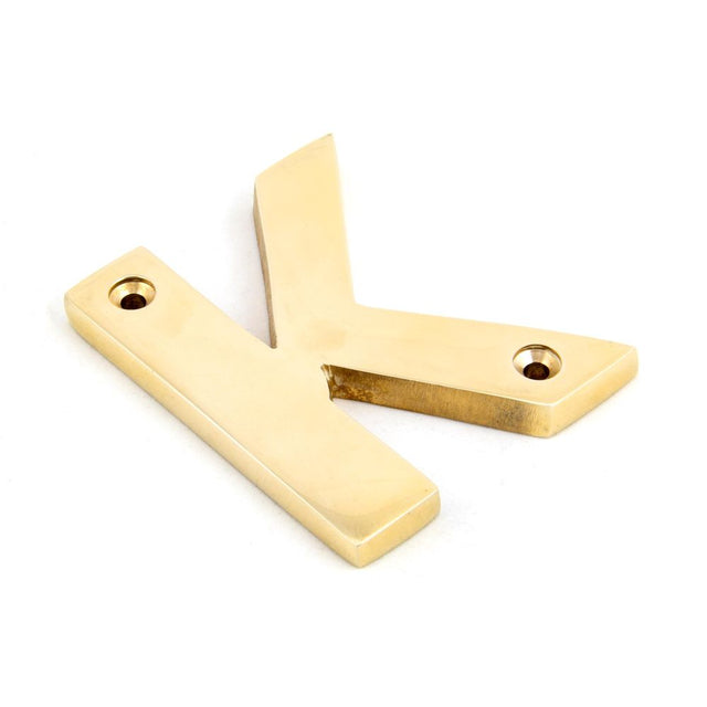 This is an image of From The Anvil - Polished Brass Letter K available to order from T.H Wiggans Architectural Ironmongery in Kendal, quick delivery and discounted prices.