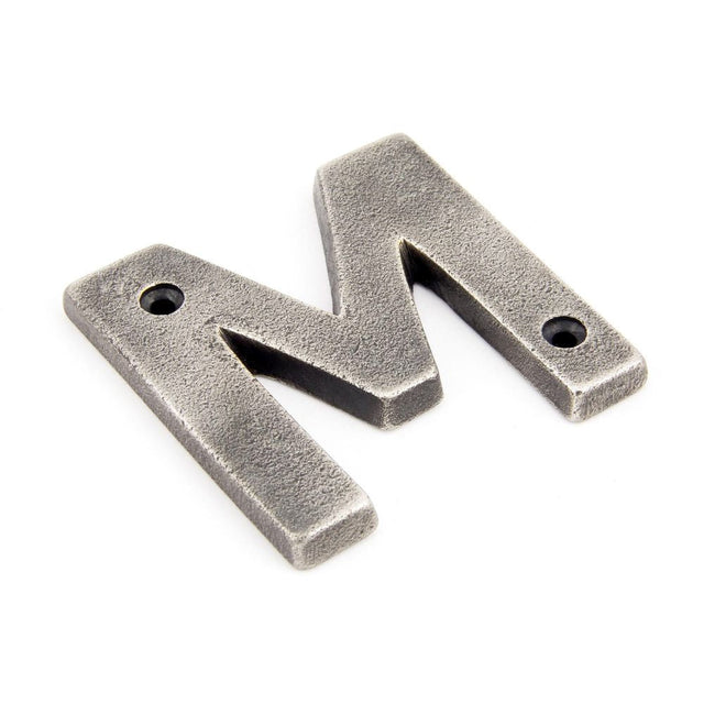 This is an image of From The Anvil - Antique Pewter Letter M available to order from T.H Wiggans Architectural Ironmongery in Kendal, quick delivery and discounted prices.