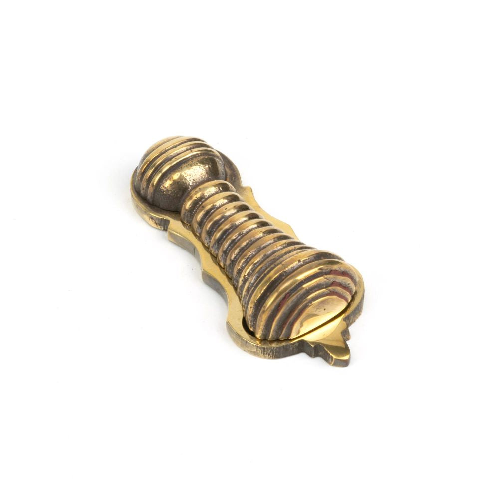 This is an image showing From The Anvil - Aged Brass Beehive Escutcheon available from trade door handles, quick delivery and discounted prices