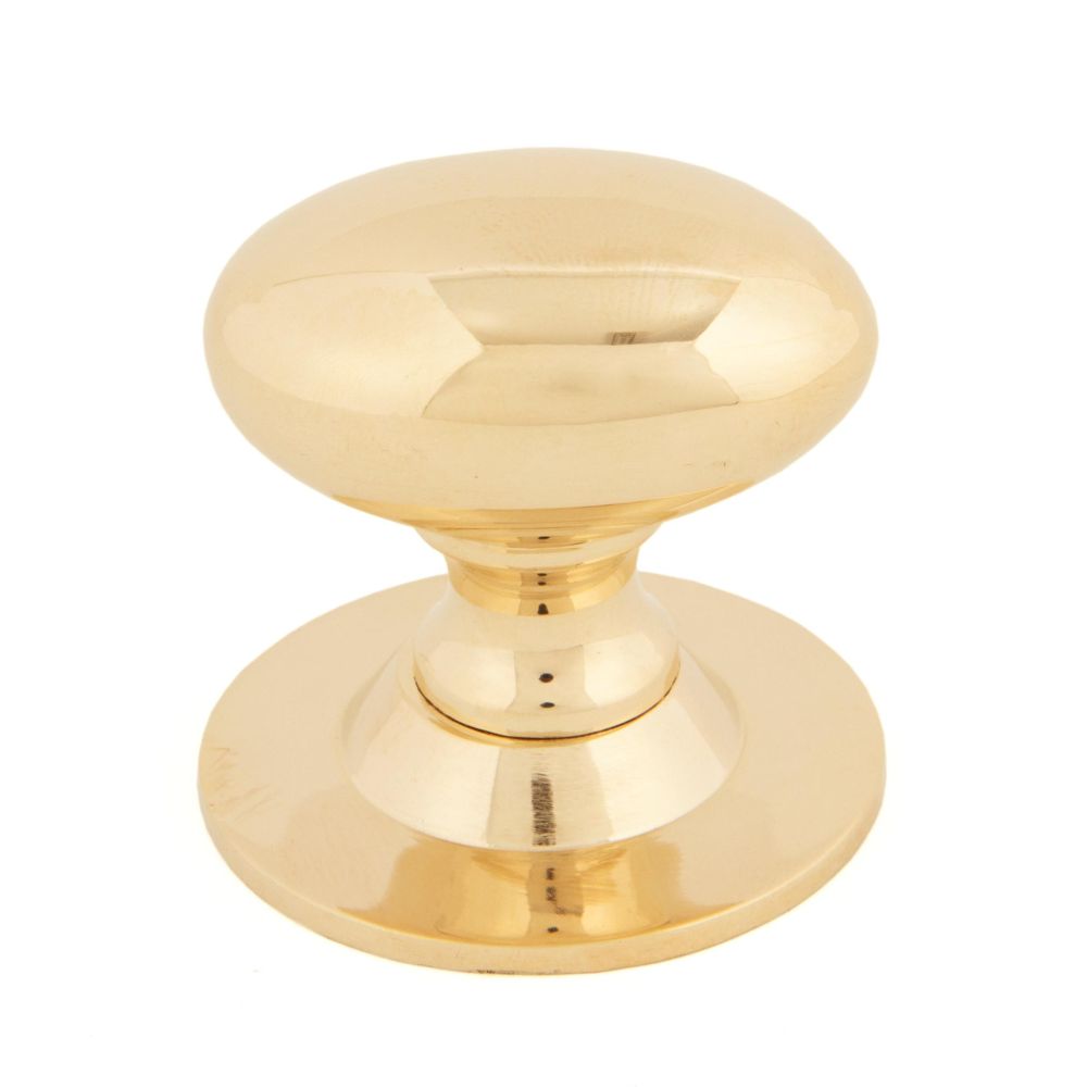 This is an image showing From The Anvil - Polished Brass Oval Cabinet Knob 40mm available from T.H Wiggans Architectural Ironmongery in Kendal, quick delivery and discounted prices