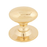 This is an image showing From The Anvil - Polished Brass Oval Cabinet Knob 40mm available from T.H Wiggans Architectural Ironmongery in Kendal, quick delivery and discounted prices