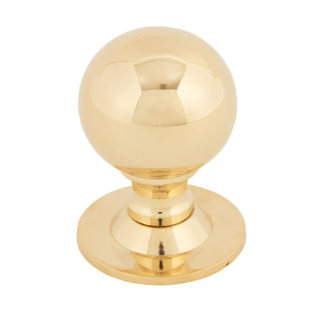 This is an image showing From The Anvil - Polished Brass Ball Cabinet Knob 39mm available from T.H Wiggans Architectural Ironmongery in Kendal, quick delivery and discounted prices