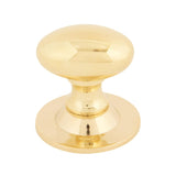 This is an image showing From The Anvil - Polished Brass Oval Cabinet Knob 33mm available from T.H Wiggans Architectural Ironmongery in Kendal, quick delivery and discounted prices