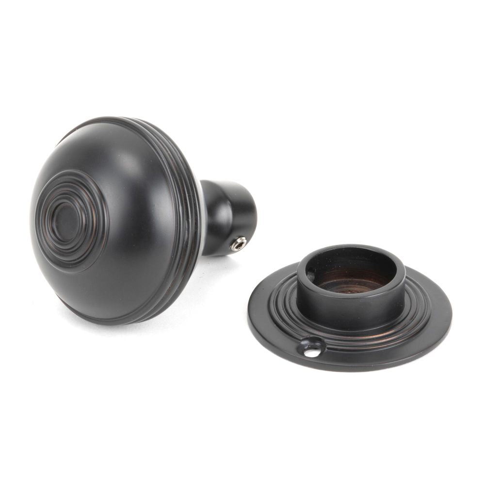 This is an image showing From The Anvil - Aged Bronze 50mm Prestbury Mortice/Rim Knob Set available from trade door handles, quick delivery and discounted prices