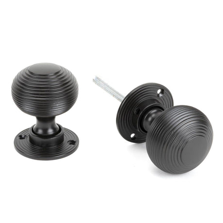 This is an image of From The Anvil - Aged Bronze Heavy Beehive Mortice/Rim Knob Set available to order from T.H Wiggans Architectural Ironmongery in Kendal, quick delivery and discounted prices.