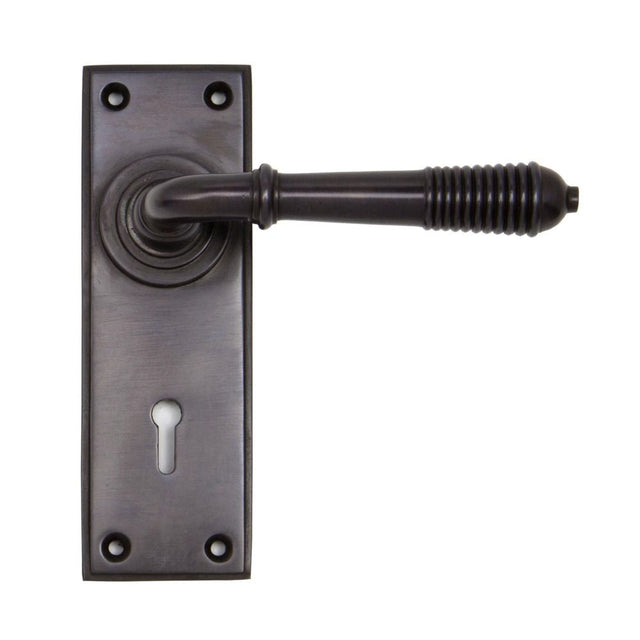 This is an image of From The Anvil - Aged Bronze Reeded Lever Lock Set available to order from T.H Wiggans Architectural Ironmongery in Kendal, quick delivery and discounted prices.