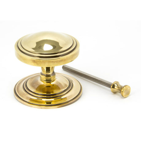 This is an image showing From The Anvil - Aged Brass Art Deco Centre Door Knob available from trade door handles, quick delivery and discounted prices