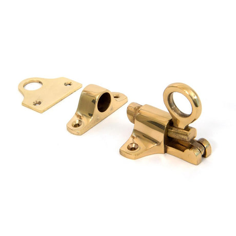 This is an image showing From The Anvil - Lacquered Brass Fanlight Catch + Two Keeps available from T.H Wiggans Architectural Ironmongery in Kendal, quick delivery and discounted prices