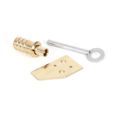 This is an image showing From The Anvil - Polished Brass Key-Flush Sash Stop available from T.H Wiggans Architectural Ironmongery in Kendal, quick delivery and discounted prices
