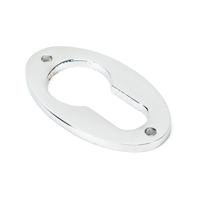 This is an image of From The Anvil - Polished Chrome Oval Euro Escutcheon available to order from T.H Wiggans Architectural Ironmongery in Kendal, quick delivery and discounted prices.