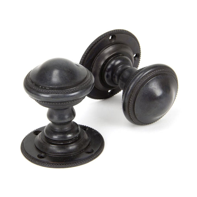 This is an image of From The Anvil - Aged Bronze Brockworth Mortice Knob Set available to order from T.H Wiggans Architectural Ironmongery in Kendal, quick delivery and discounted prices.