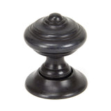 This is an image showing From The Anvil - Aged Bronze Elmore Concealed Mortice Knob Set available from trade door handles, quick delivery and discounted prices