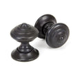 This is an image of From The Anvil - Aged Bronze Elmore Concealed Mortice Knob Set available to order from T.H Wiggans Architectural Ironmongery in Kendal, quick delivery and discounted prices.