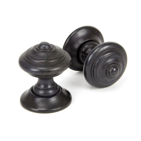 This is an image of From The Anvil - Aged Bronze Elmore Concealed Mortice Knob Set available to order from T.H Wiggans Architectural Ironmongery in Kendal, quick delivery and discounted prices.