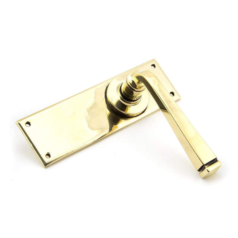 This is an image showing From The Anvil - Aged Brass Avon Lever Latch Set available from trade door handles, quick delivery and discounted prices