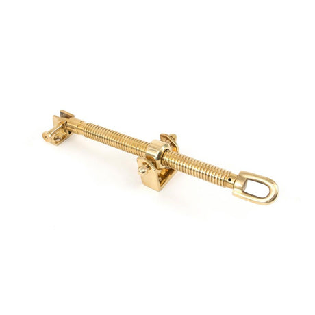 This is an image showing From The Anvil - Polished Brass 12" Fanlight Screw Opener available from T.H Wiggans Architectural Ironmongery in Kendal, quick delivery and discounted prices