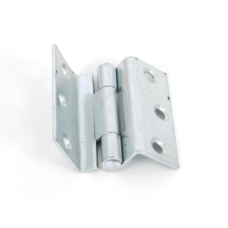 This is an image showing From The Anvil - Bright Zinc Plated 2 1/2" Stormproof Hinge 1951 (pair) available from T.H Wiggans Architectural Ironmongery in Kendal, quick delivery and discounted prices